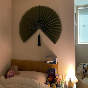 Customer photo: Moss Green hanging wall fan above a timber bed